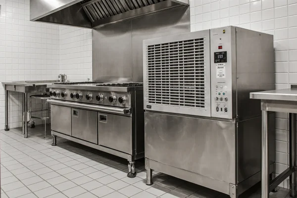 a_wide-angle_professional_photograph_of_a_large_bustling_industrial_commercial_kitchen_with_gleamin_86u2s7j3sejbj4bajlro_2